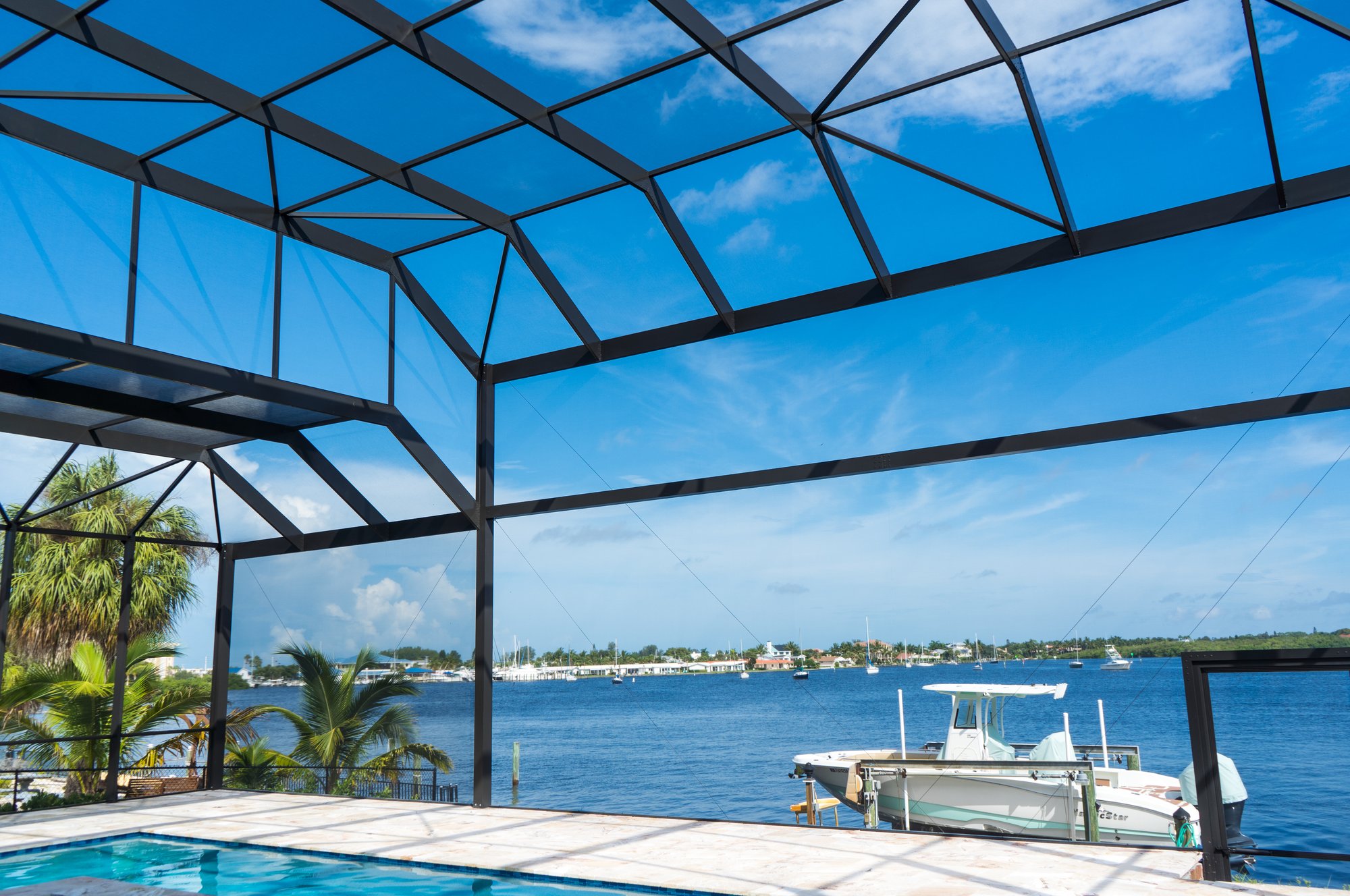 Large custom aluminum pool enclosure built by NXT Level Screening